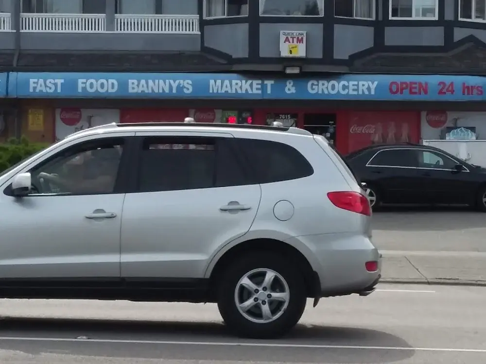 Street facade of Banny's Market in Surrey with the market banner over the storefront