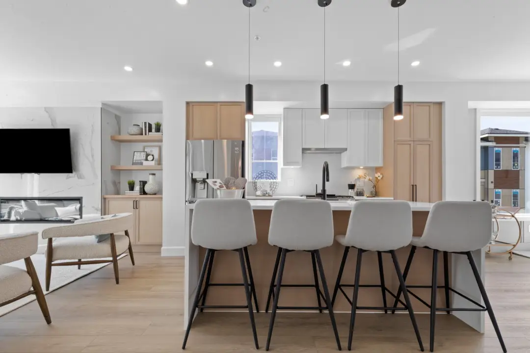 Crofton open kitchen with pendant lights over island and recessed pot lights