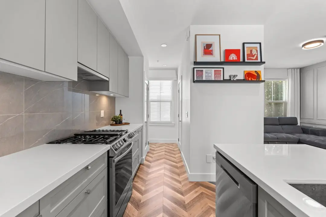 Frame kitchen range wall with recessed lighting and herringbone flooring