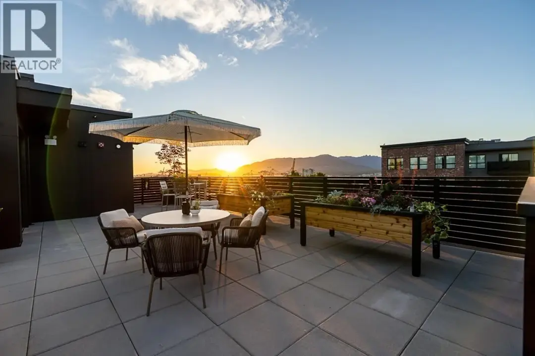 Sunset rooftop terrace at Lakewood in Vancouver with exterior wall lights on the bulkhead