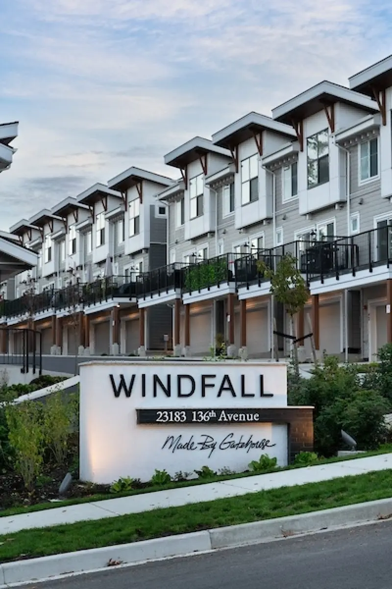 Daytime WINDFALL monument sign and townhome row in Maple Ridge