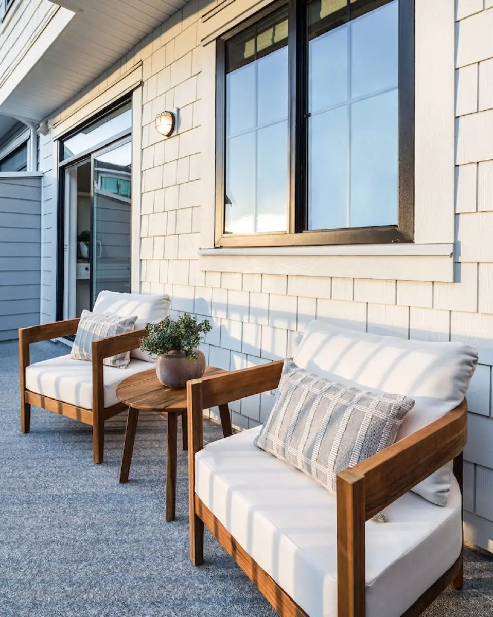Madewell balcony patio with an outdoor wall sconce