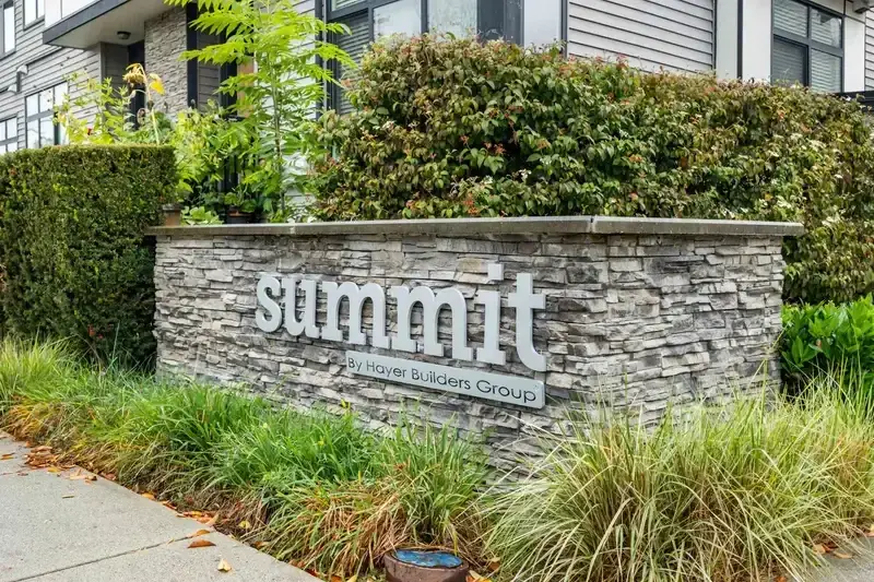 Summit by Hayer Builders Group monument sign with stone base