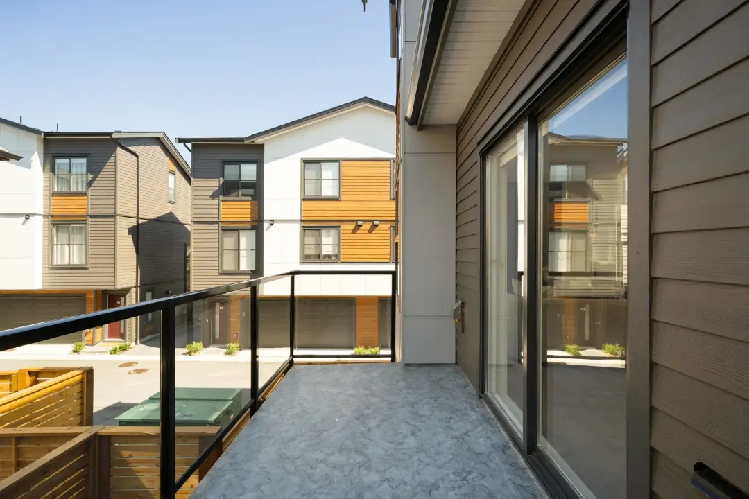Balcony courtyard view looking across to Elwynn Green townhome facades in Surrey