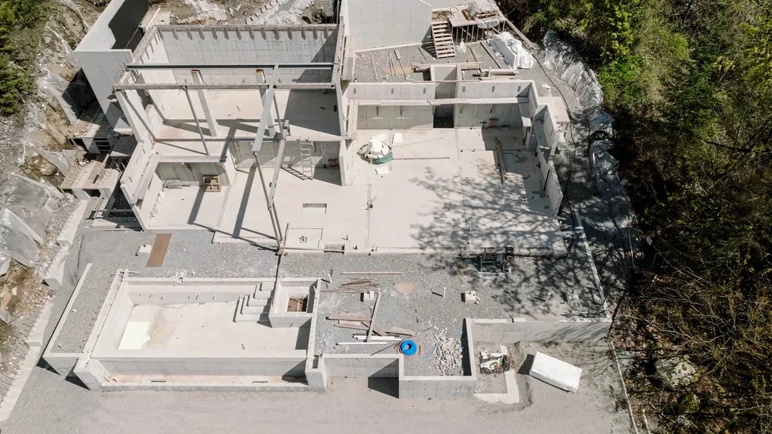 Chauhan Anmore — aerial foundation footprint with pool shell and steel framing